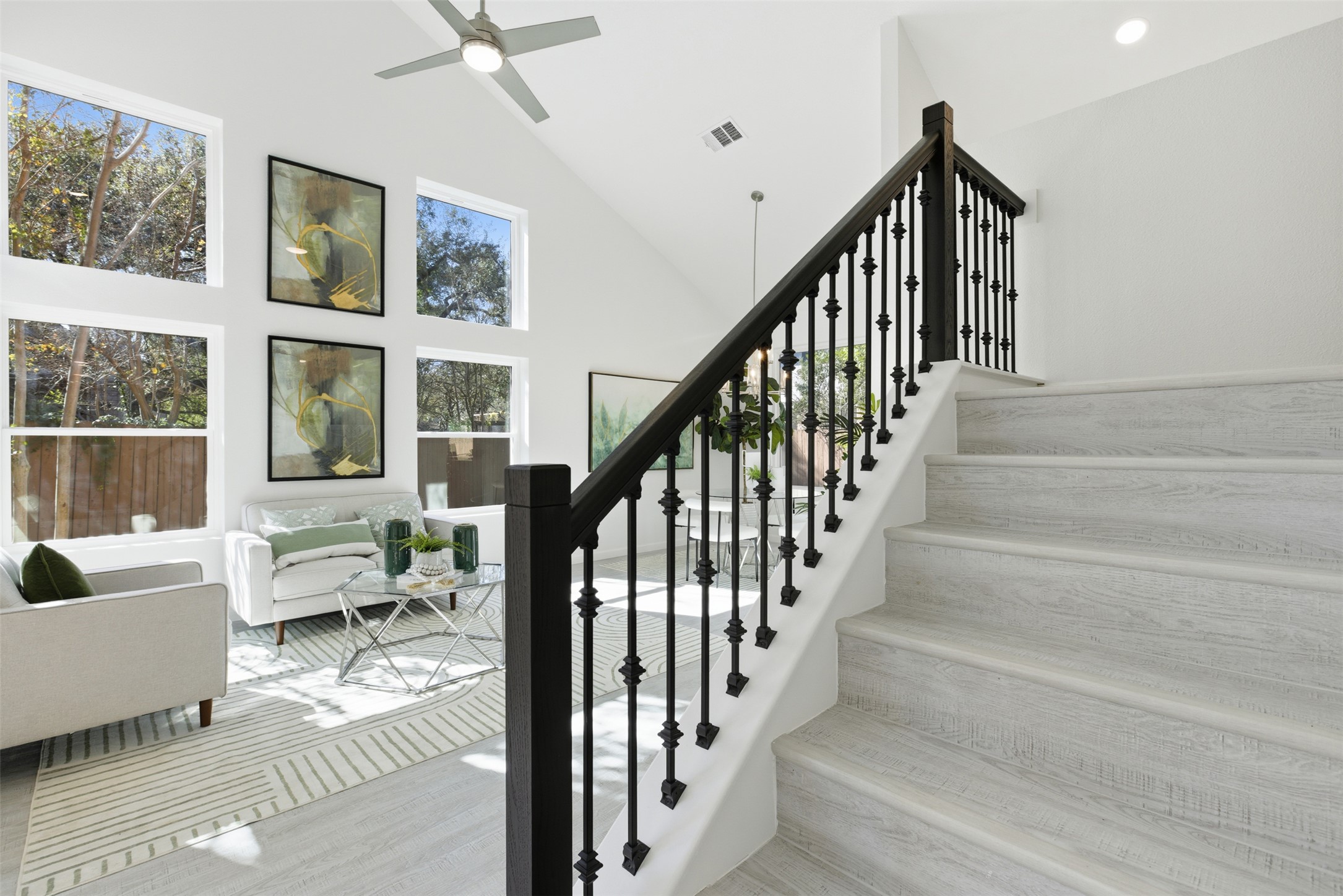 10902 Wareham Court Austin, TX 78739 - Photo 11 of 37 Stairway with high vaulted ceiling, wood finished floors, and a ceiling fan