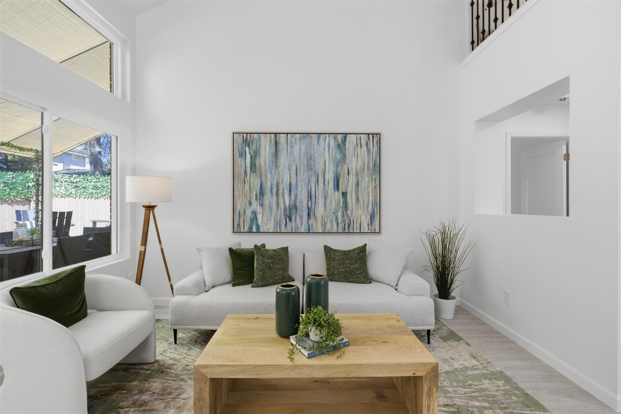 10902 Wareham Court Austin, TX 78739 - Photo 16 of 37 Living area with wood finished floors and a high ceiling