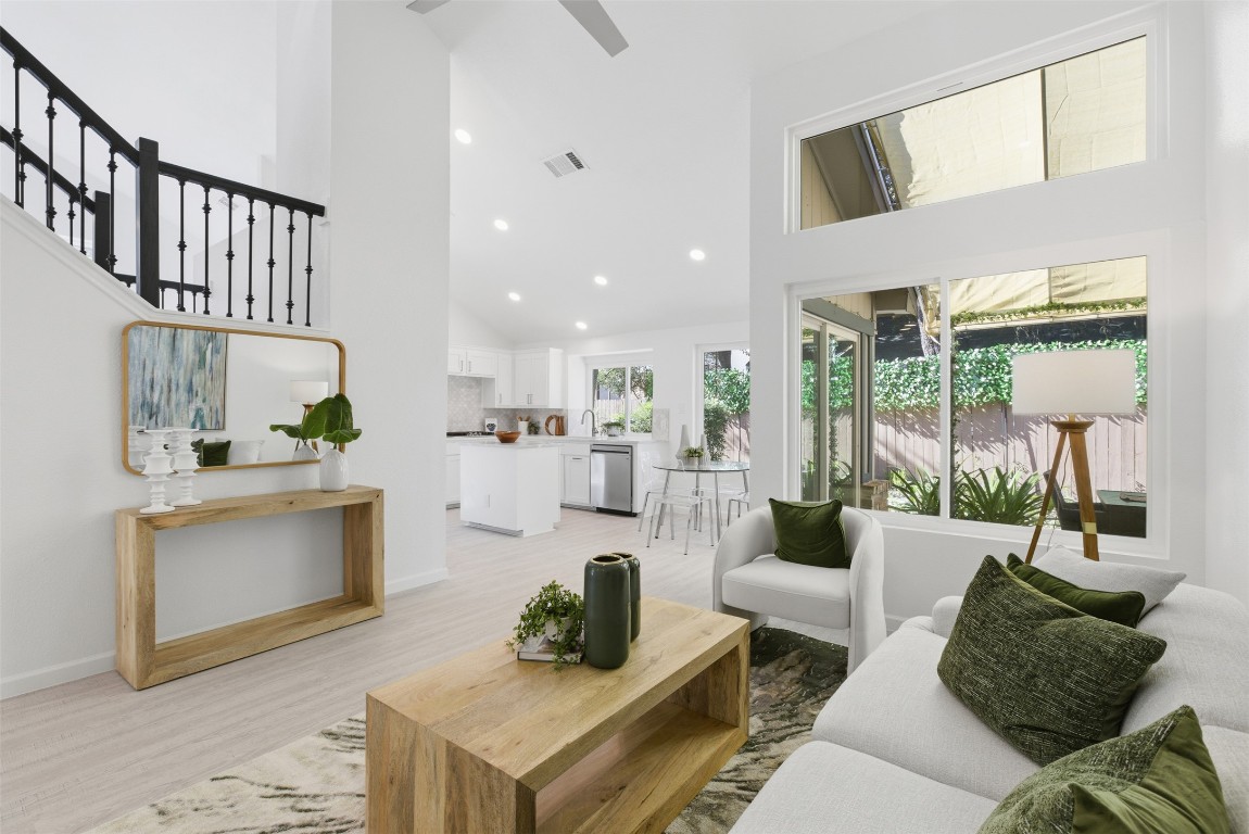 10902 Wareham Court Austin, TX 78739 - Photo 4 of 37 a living room with furniture a rug and a large window