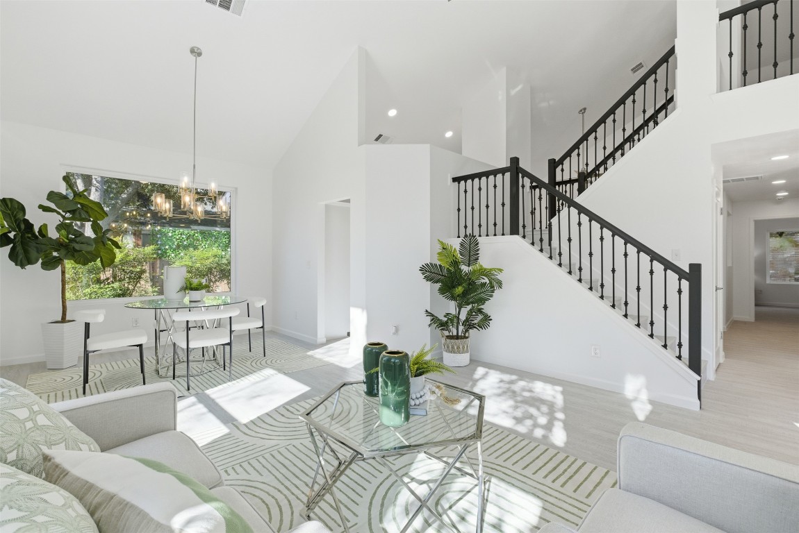 10902 Wareham Court Austin, TX 78739 - Photo 10 of 37 a living room with furniture and a potted plant