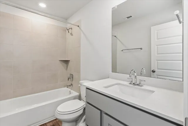 a bathroom with a sink a toilet and a bathtub