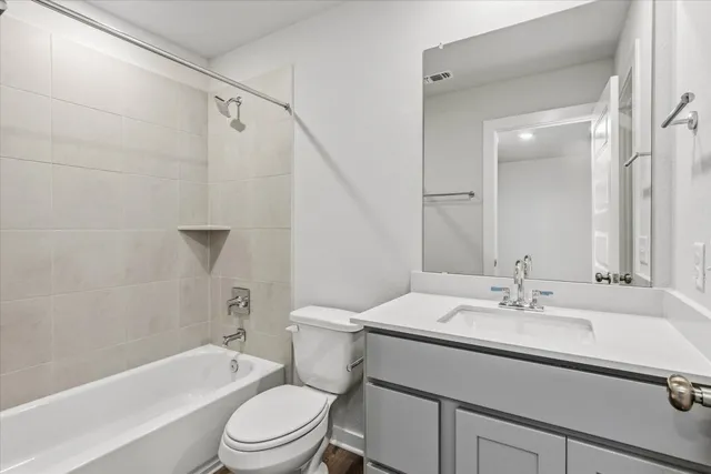 a bathroom with a sink a toilet and a bathtub