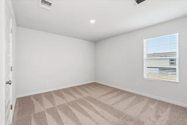 a view of an empty room and window