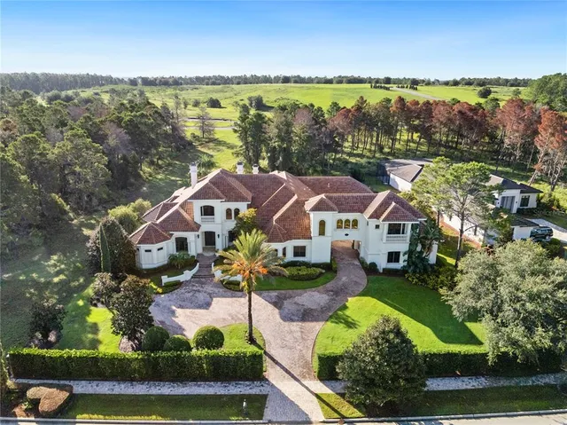 a view of a livingroom with furniture and a window