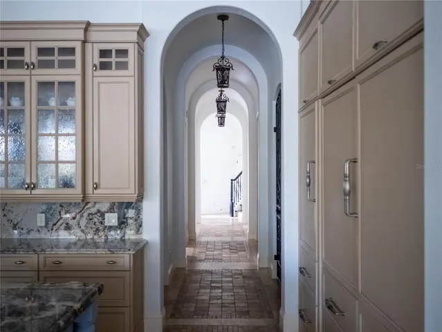 a view of walk in closet with clothes