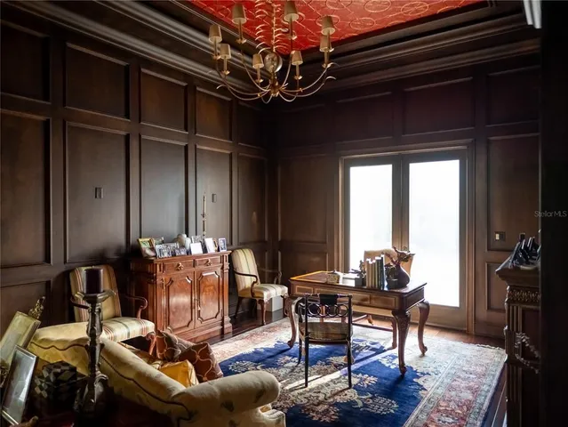 a bedroom with a bed and a mirror