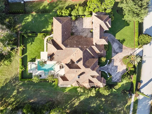 a living room with furniture and a large mirror