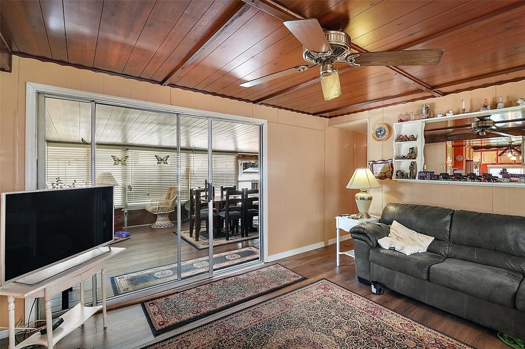9935 Southeast 168th Place Summerfield, FL 34491 - Photo 14 of 25 a living room with furniture and a flat screen tv