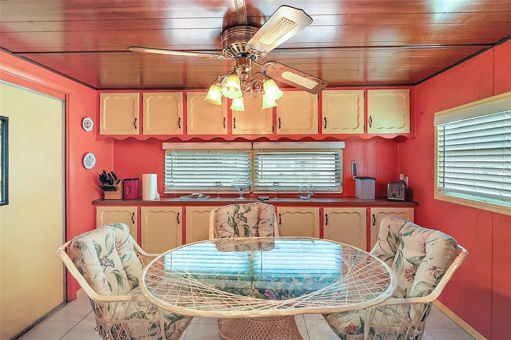 9935 Southeast 168th Place Summerfield, FL 34491 - Photo 16 of 25 a dining room with furniture and window