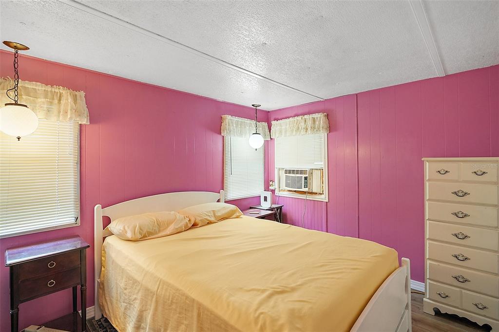 9935 Southeast 168th Place Summerfield, FL 34491 - Photo 21 of 25 a bedroom with a bed and a dresser