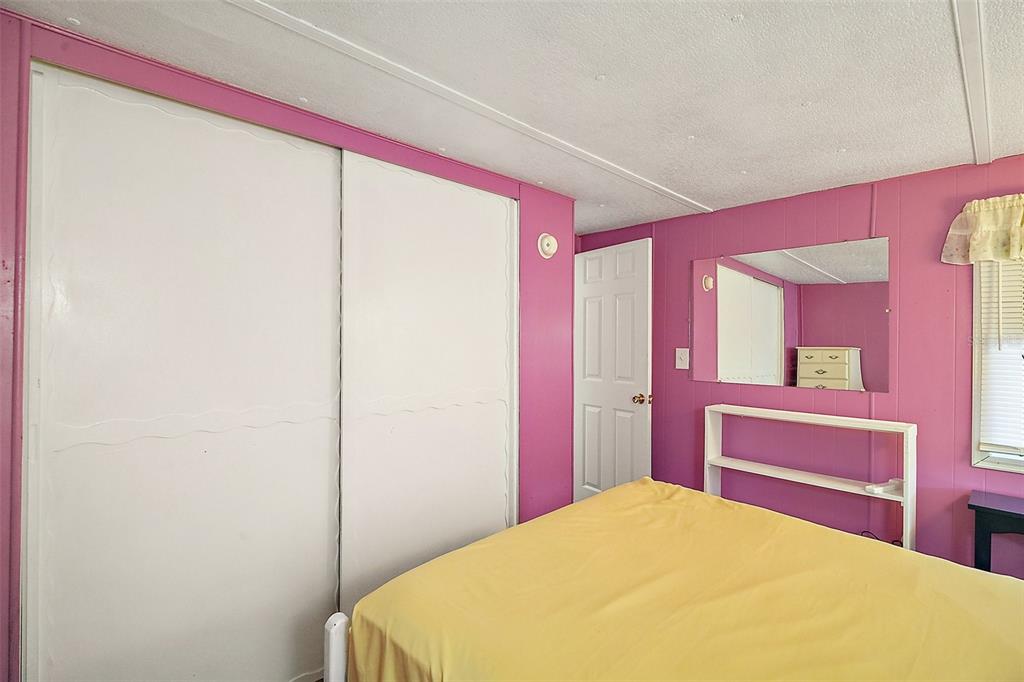 9935 Southeast 168th Place Summerfield, FL 34491 - Photo 22 of 25 a bedroom with a bed and a dresser