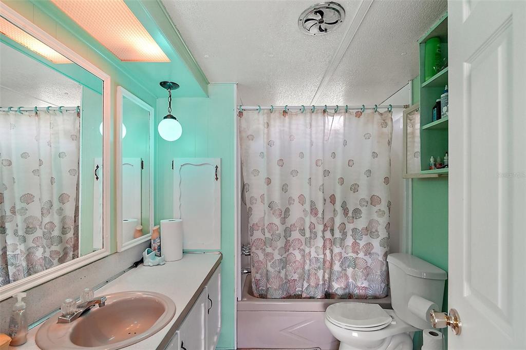 9935 Southeast 168th Place Summerfield, FL 34491 - Photo 24 of 25 a bathroom with a sink toilet and shower