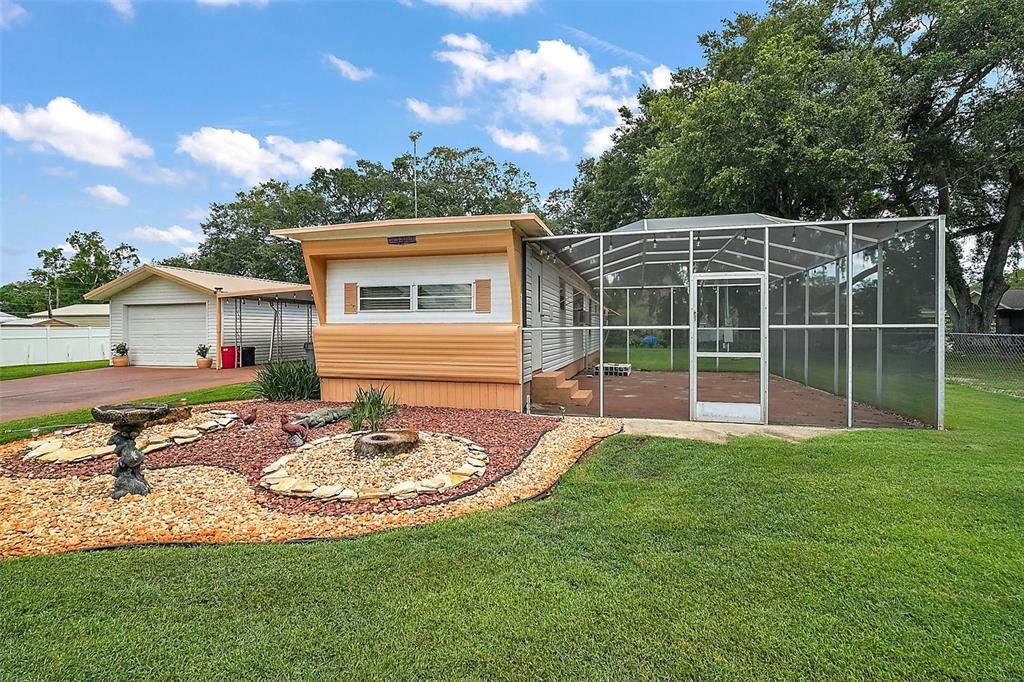 9935 Southeast 168th Place Summerfield, FL 34491 - Photo 8 of 25 a view of a house with backyard and sitting area