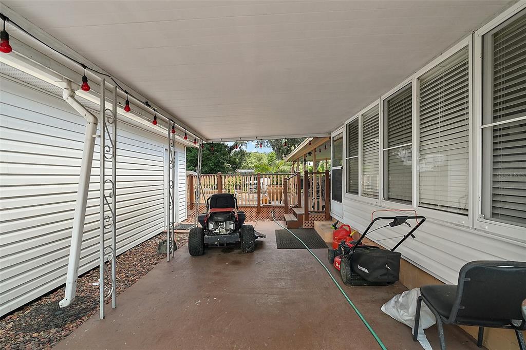 9935 Southeast 168th Place Summerfield, FL 34491 - Photo 10 of 25 a view of a patio with chairs and a potted plant
