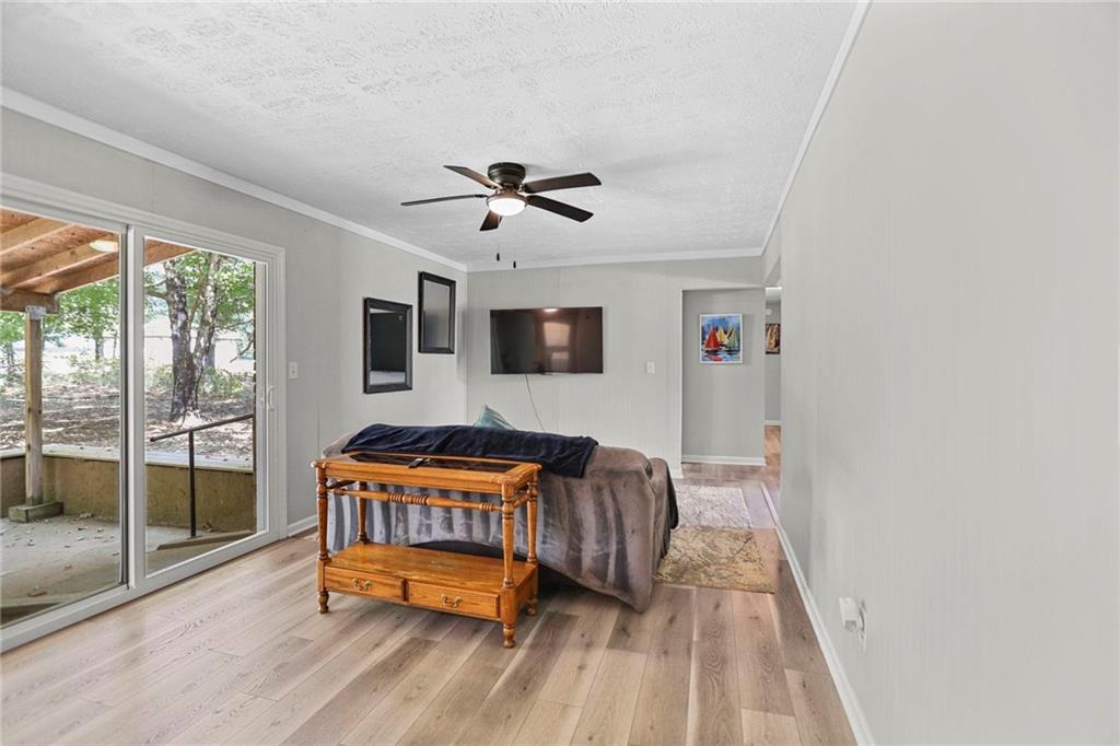 20 Carriage Trace Stockbridge, GA 30281 - Photo 16 of 35 a bedroom with a bed and wooden floor
