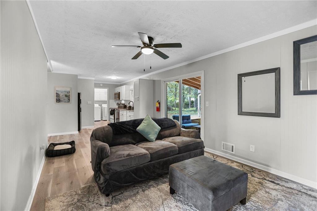 20 Carriage Trace Stockbridge, GA 30281 - Photo 18 of 35 a living room with furniture and a ceiling fan