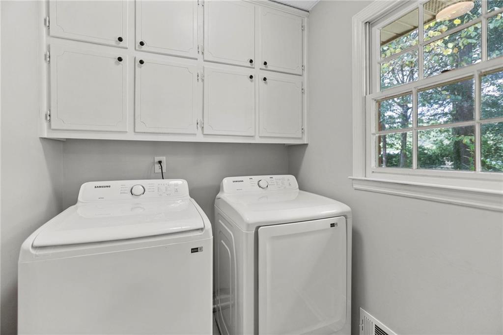 20 Carriage Trace Stockbridge, GA 30281 - Photo 19 of 35 a view of storage and utility room with washer and dryer