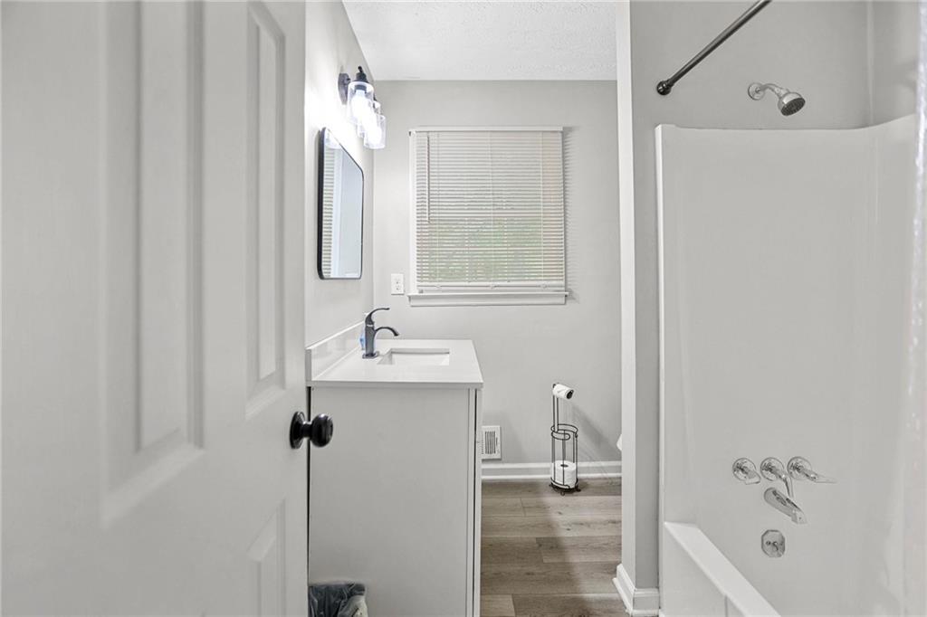 20 Carriage Trace Stockbridge, GA 30281 - Photo 21 of 35 a bathroom with a sink a toilet and shower