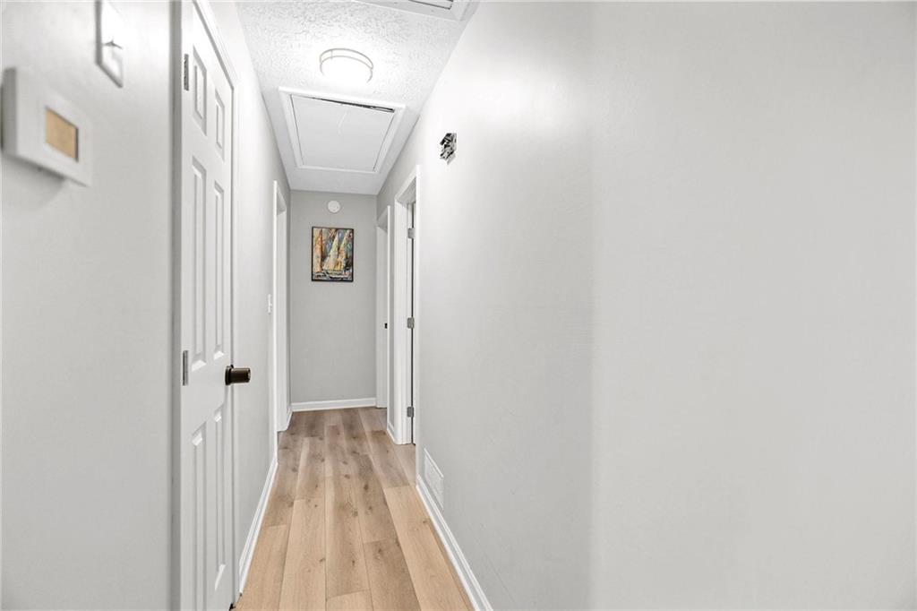 20 Carriage Trace Stockbridge, GA 30281 - Photo 24 of 35 a view of a hallway with wooden floor
