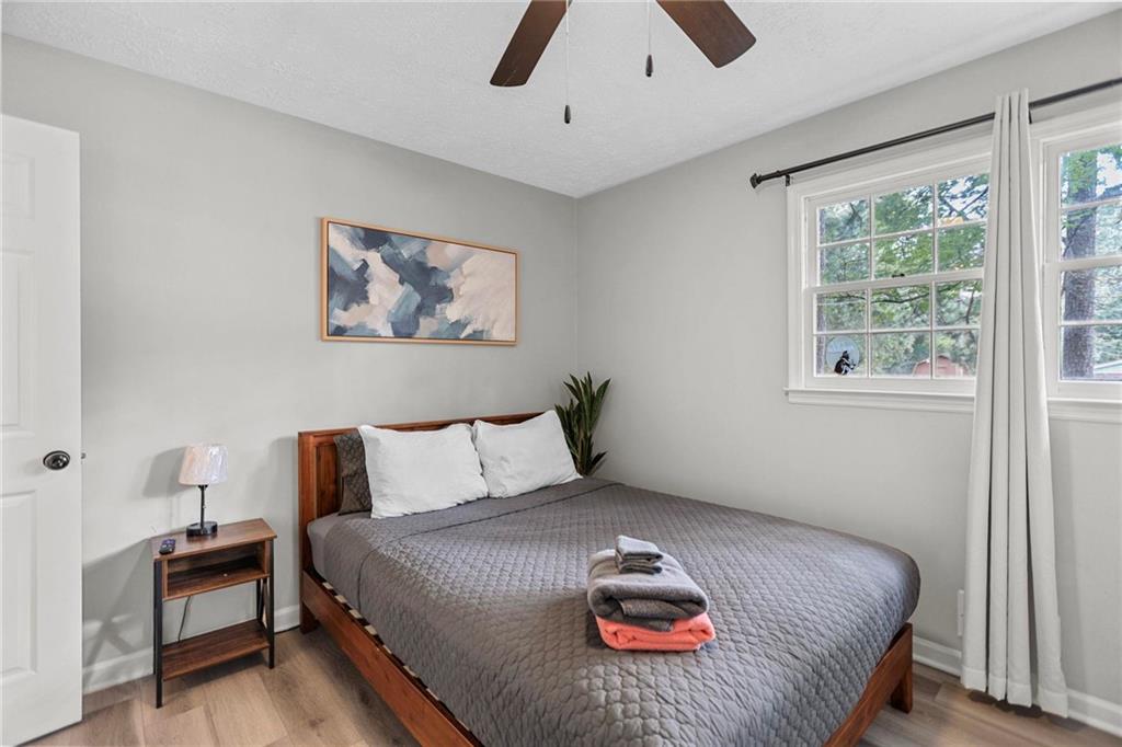 20 Carriage Trace Stockbridge, GA 30281 - Photo 26 of 35 a bedroom with a bed and wooden floor