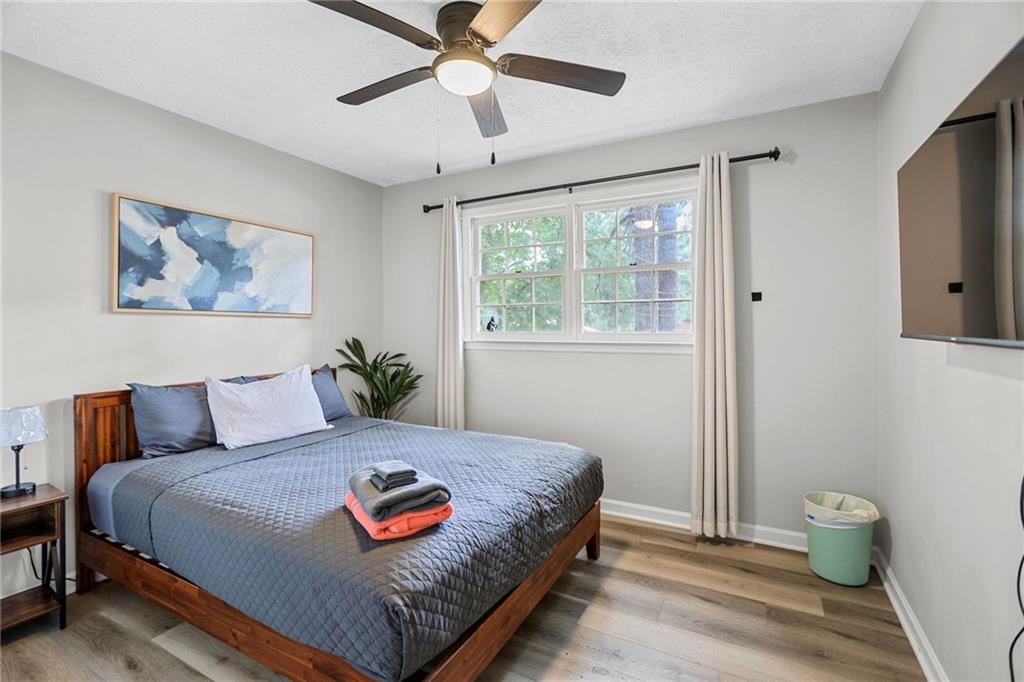 20 Carriage Trace Stockbridge, GA 30281 - Photo 27 of 35 a bedroom with a bed and a chandelier