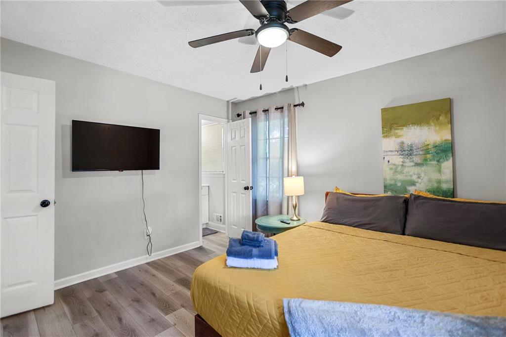 20 Carriage Trace Stockbridge, GA 30281 - Photo 30 of 35 a bedroom with a bed and a flat screen tv