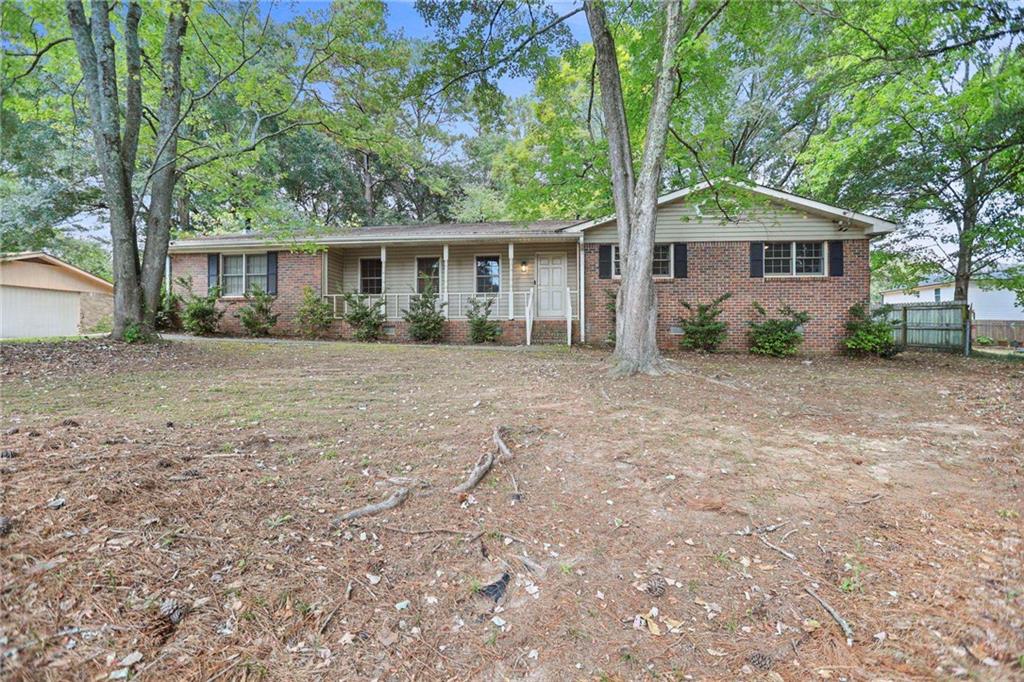 20 Carriage Trace Stockbridge, GA 30281 - Photo 3 of 35 front view of a house with a trees