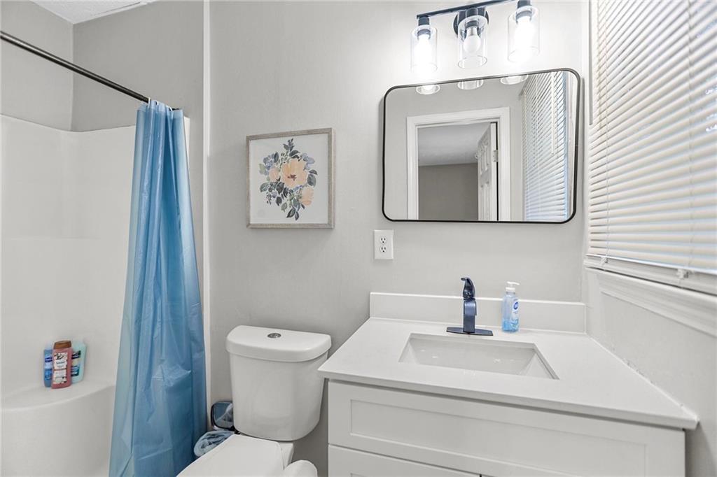 20 Carriage Trace Stockbridge, GA 30281 - Photo 31 of 35 a bathroom with a toilet sink and mirror