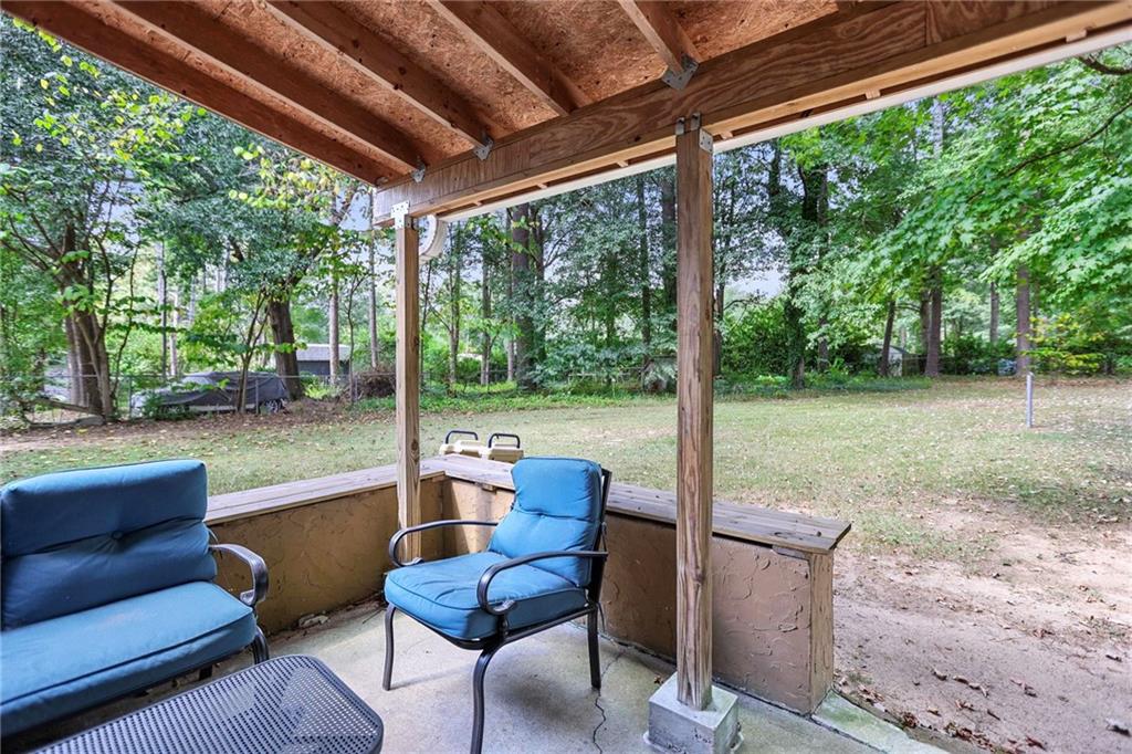 20 Carriage Trace Stockbridge, GA 30281 - Photo 32 of 35 a view of a patio with couches chairs and a backyard