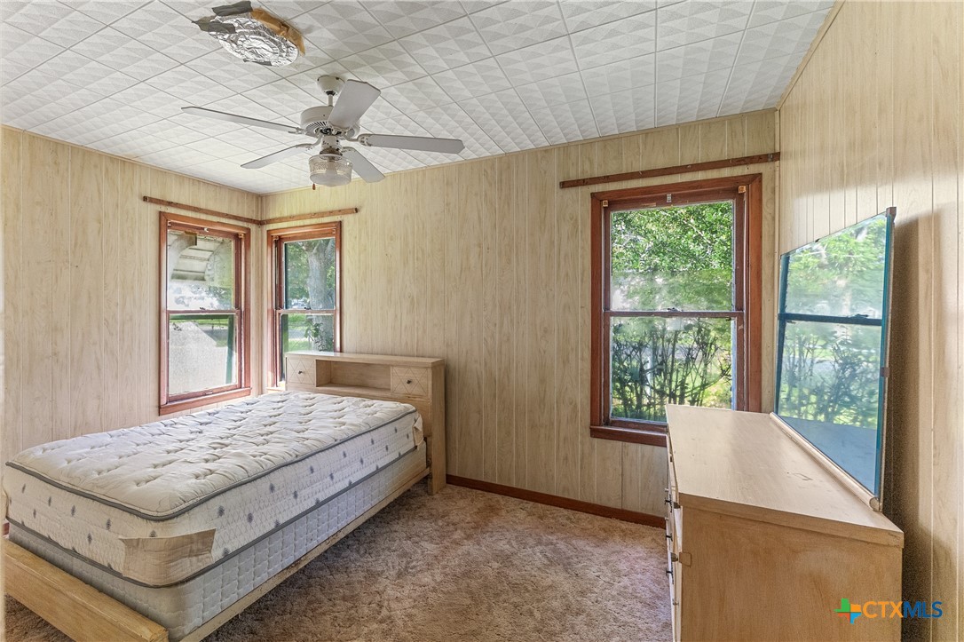 401 Kerr Street Edna, TX 77957 - Photo 14 of 23 a bedroom with a bed and window