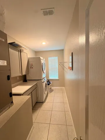 a bathroom with double vanity sink a mirror a vanity and shower