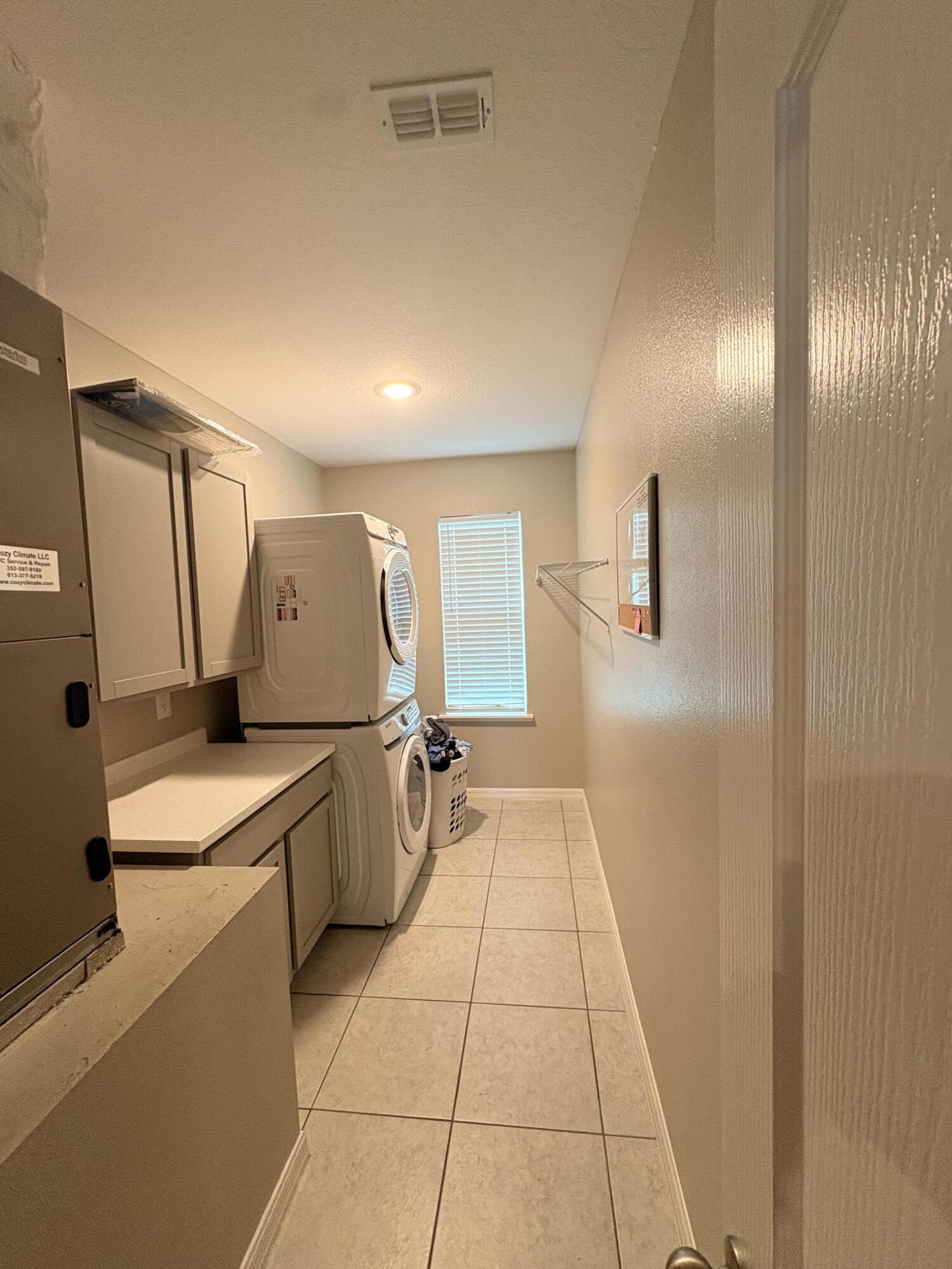 9237 Swiss Road Spring Hill, FL 34606 - Photo 13 of 15 a bathroom with a sink a toilet and mirror