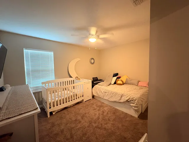 a bed room with furniture and a window
