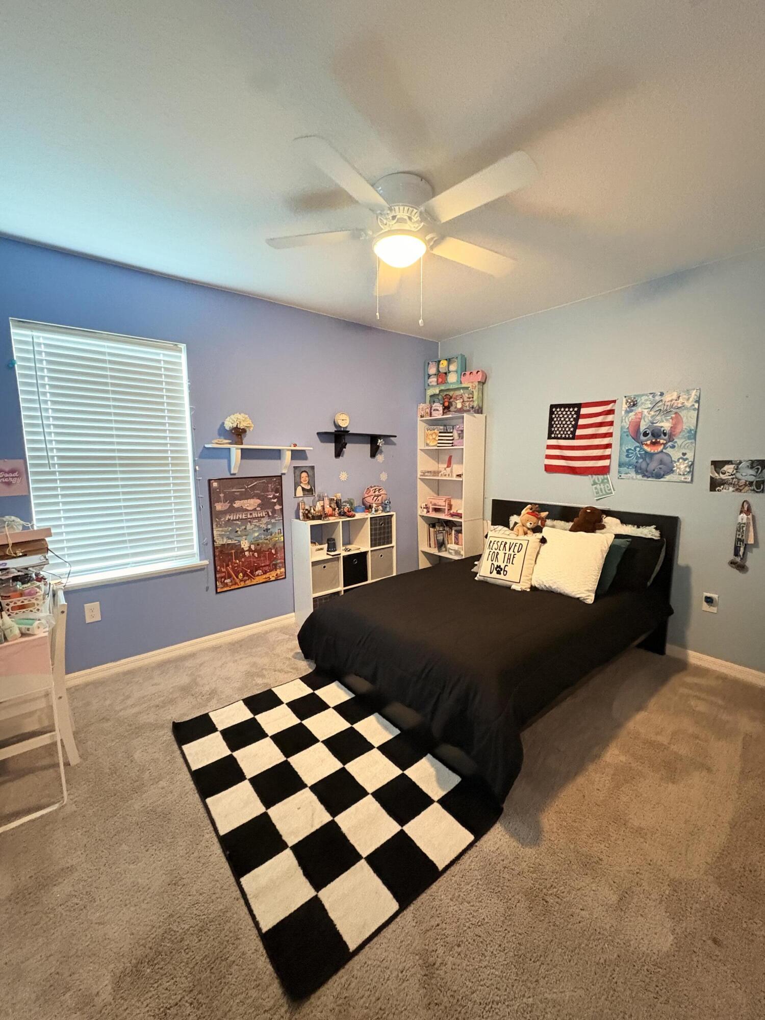 9237 Swiss Road Spring Hill, FL 34606 - Photo 6 of 15 a bedroom with a bed and a dresser next to a window