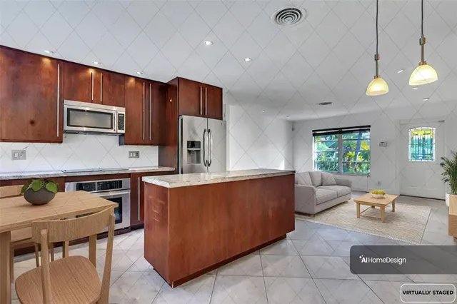 a kitchen with stainless steel appliances granite countertop a sink wooden cabinets and a refrigerator