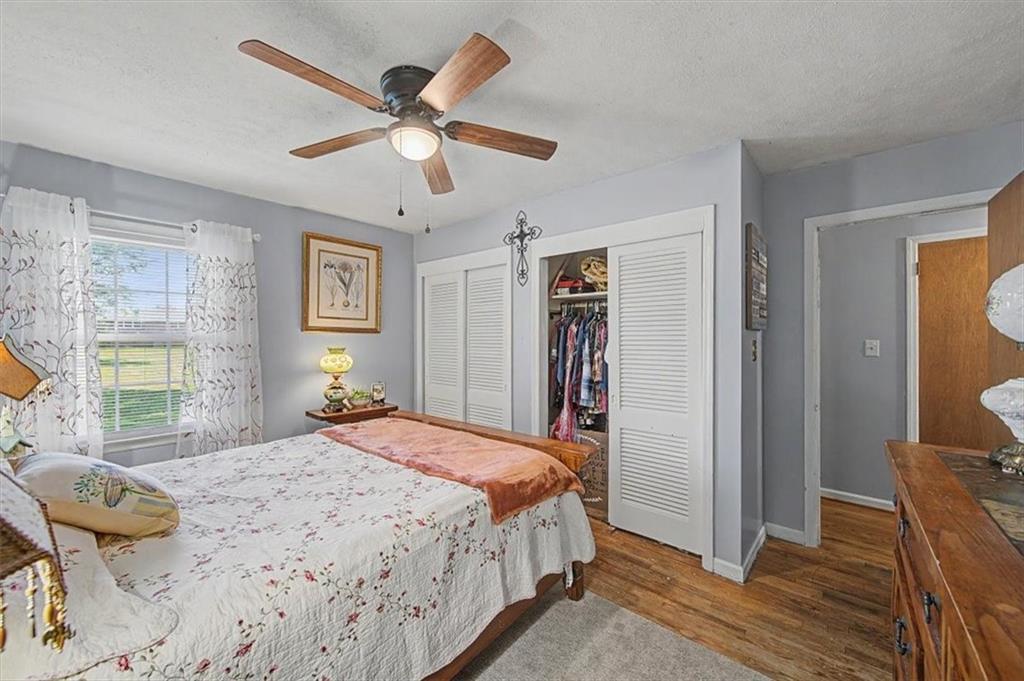 71 North Avery Road Northwest Rome, GA 30165 - Photo 20 of 42 a bedroom with a bed and wooden floor