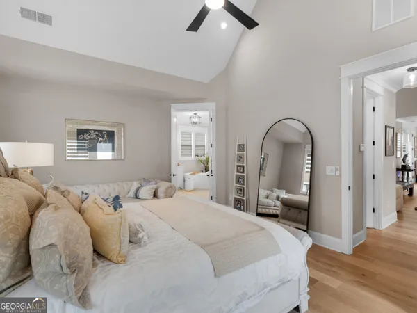 a bathroom with a sink mirror and a bathtub