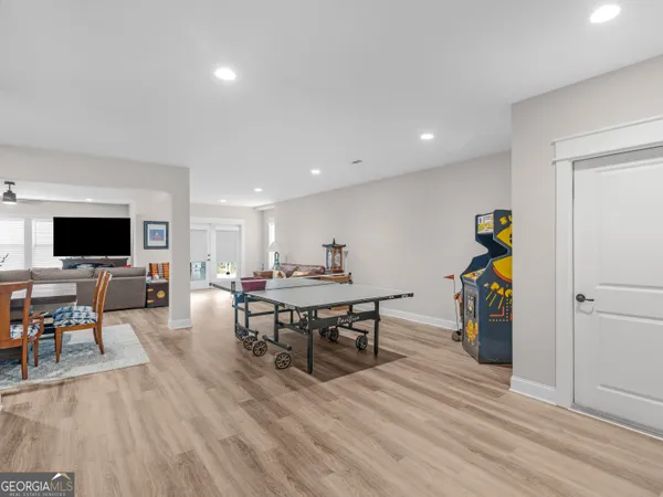 a dining room with furniture and a refrigerator