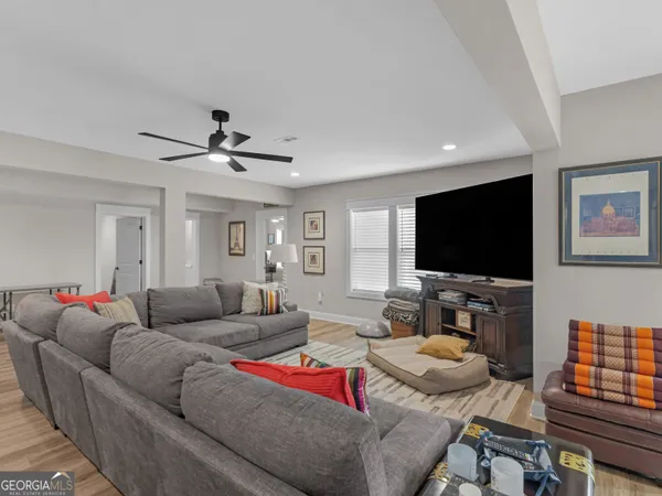 a living room with furniture and a window