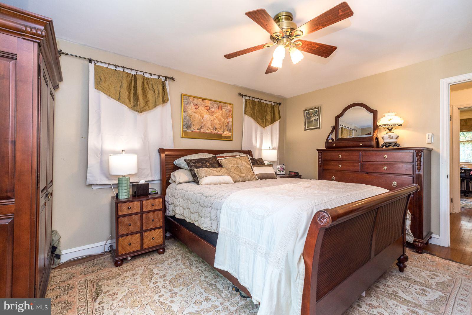 534 Pinney Road Huntingdon Valley, PA 19006 - Photo 12 of 26 a bedroom with a bed and a lamp on a dresser