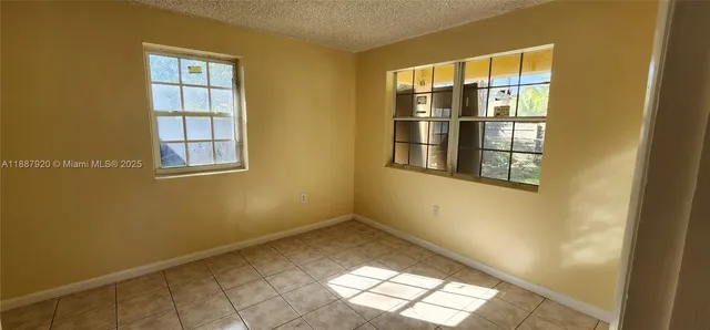 a view of empty room with windows