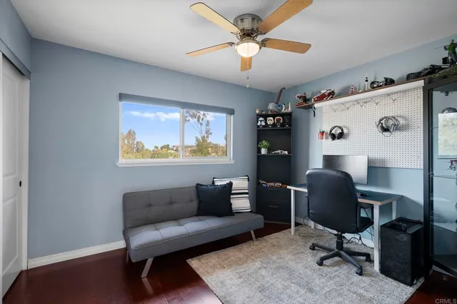 a work room with furniture and a window