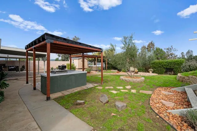 a view of a backyard with sitting area