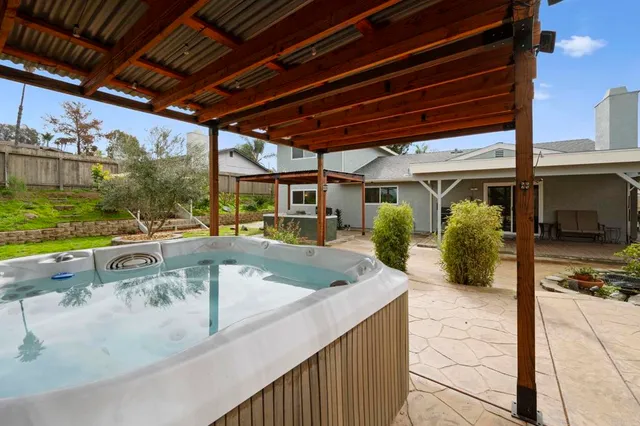 a view of a backyard with sitting area