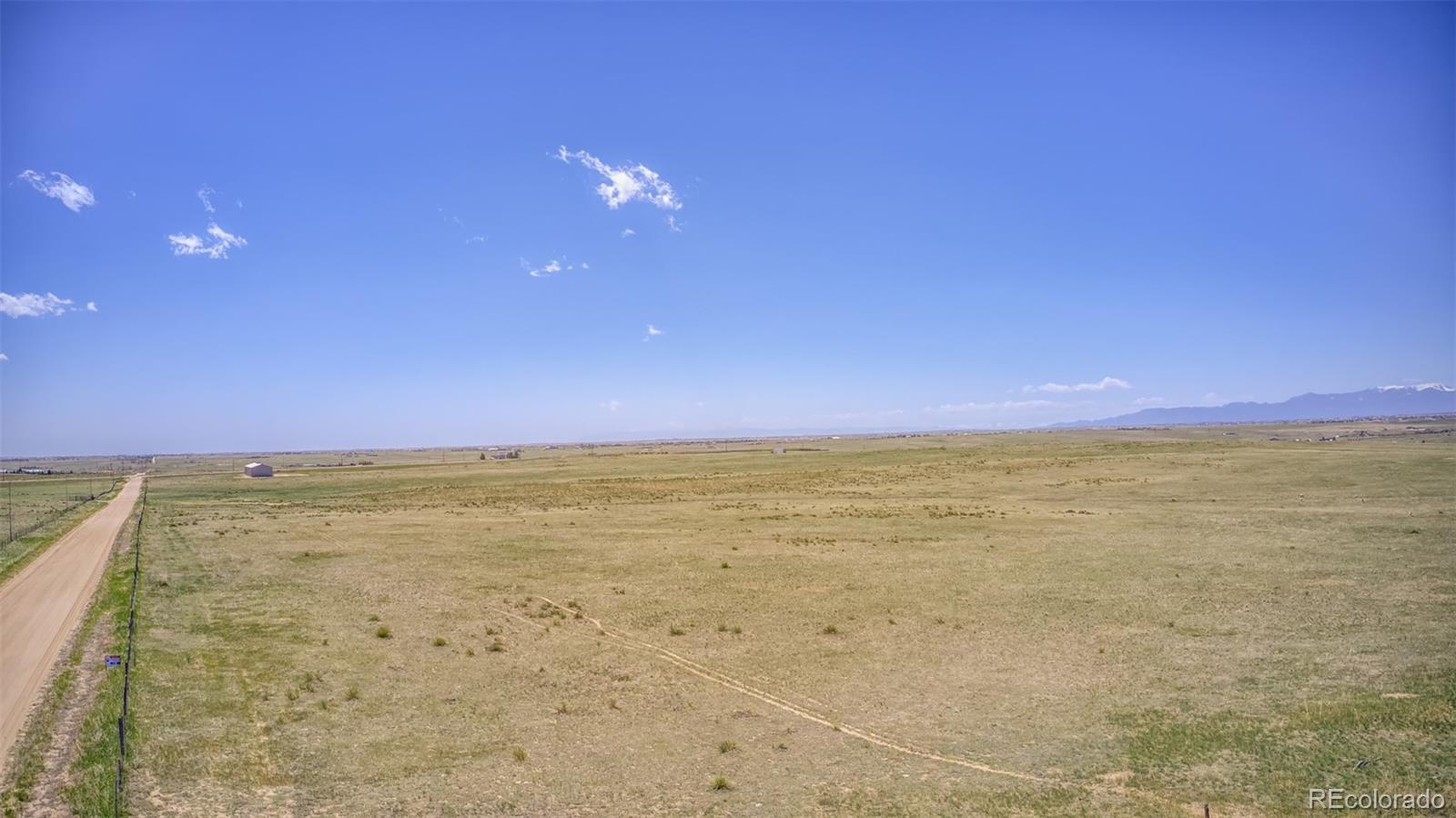 13886 Log Road Peyton, CO 80831 - Photo 2 of 14 a view of an ocean beach