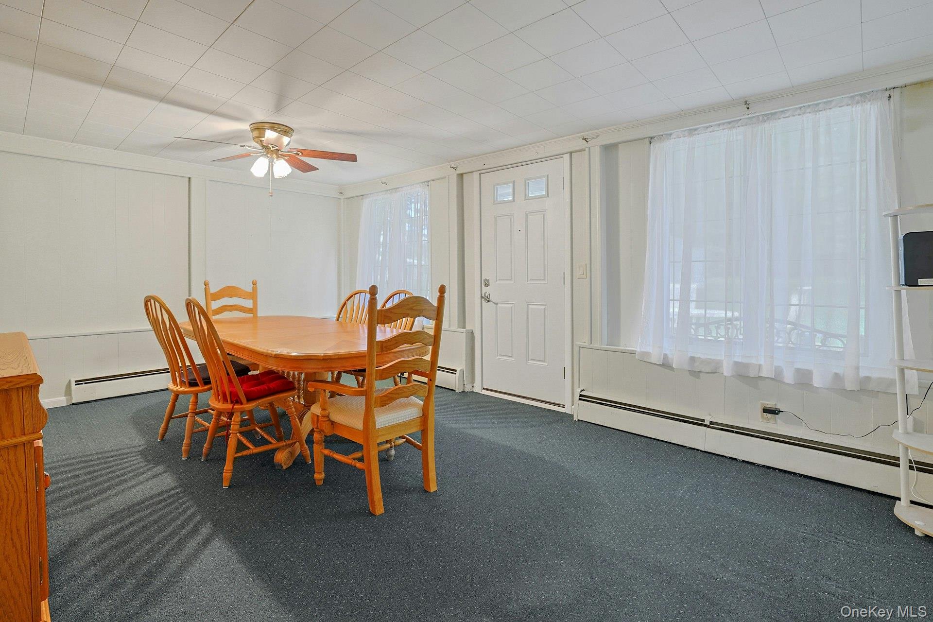 31 Townline Road Pearl River, NY 10965 - Photo 11 of 27 a dining room with furniture and a chandelier