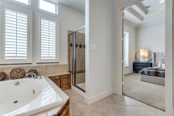 a bath tub sitting in a bathroom next to a window