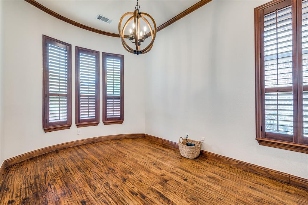 8237 Inverness The Colony, TX 75056 - Photo 15 of 22 a view of an empty room with wooden floor and a window