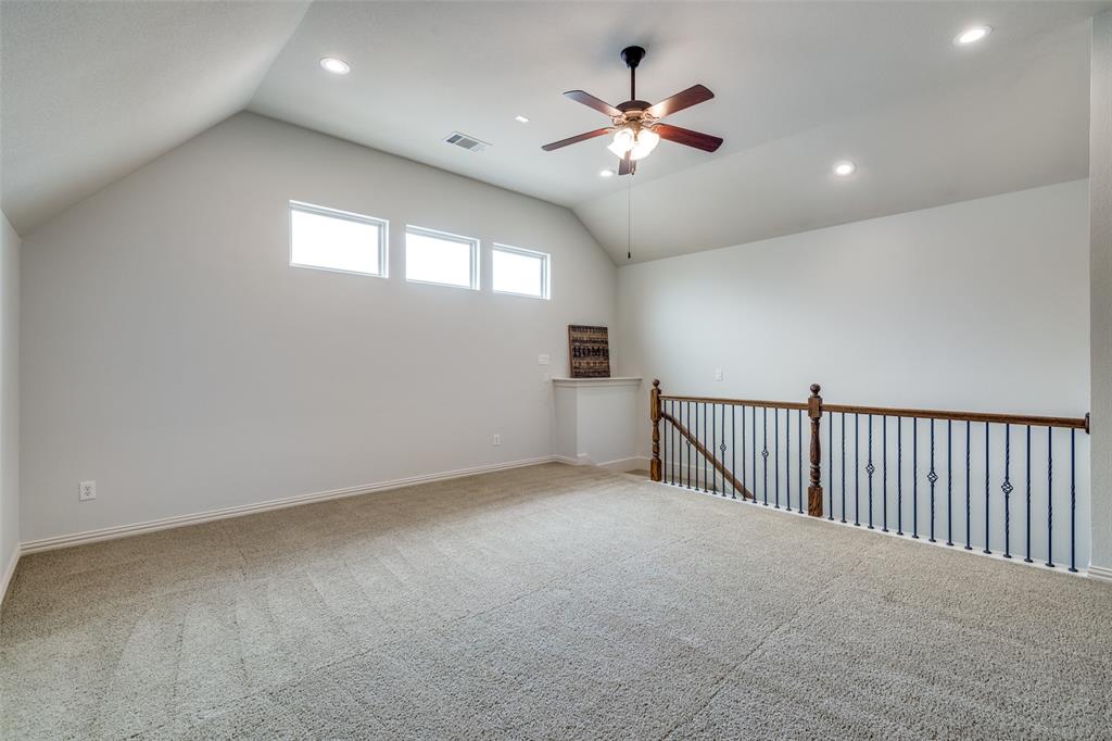 8237 Inverness The Colony, TX 75056 - Photo 19 of 22 a view of an empty room with a chandelier fan