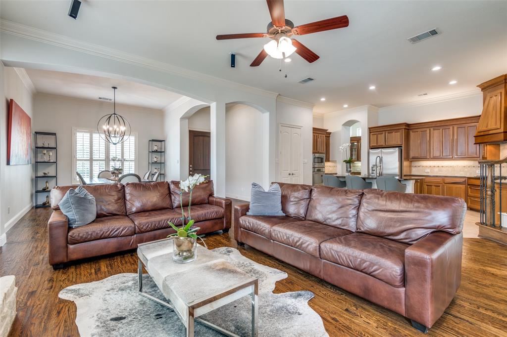 8237 Inverness The Colony, TX 75056 - Photo 2 of 22 a living room with furniture kitchen view and a chandelier